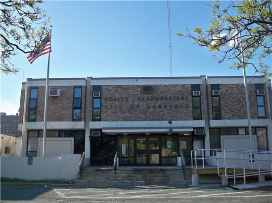 Image of multi story building with stair case and flag