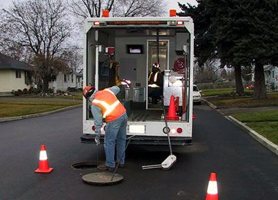 Sewer Inspection Vehicle and Worker 